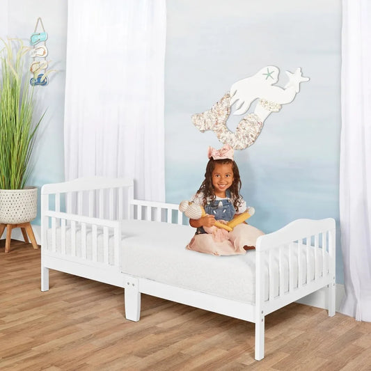 Classic Design Toddler Bed In White Low To Floor Design With Two Side Rails Non Toxic Finishes Wooden Nursery Furniture
